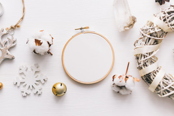 Flat lay top view Christmas photo with an embroidery hoop and cute decoration. © Senpo