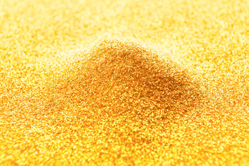 Golden glitter pile, bright luxury background