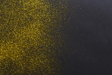 Golden glitter sand texture, abstract background.