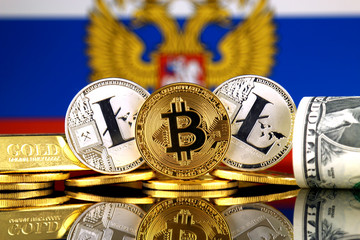 Physical version of Bitcoin, Litecoin, gold, US Dollar and Russia Flag. Conceptual image for...