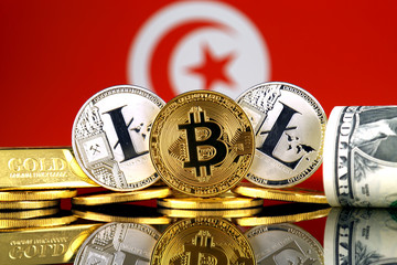 Physical version of Bitcoin, Litecoin, gold, US Dollar and Tunisia Flag. Conceptual image for...