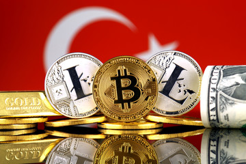 Physical version of Bitcoin, Litecoin, gold, US Dollar and Turkey Flag. Conceptual image for...