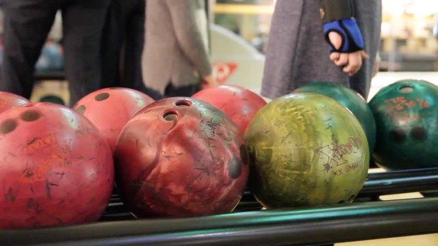 People playing a game of bowling at the small town bowling alley in Kiev, Ukraine, 02.12.2017
