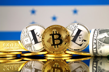 Physical version of Bitcoin, Litecoin, gold, US Dollar and Honduras Flag. Conceptual image for investors in cryptocurrency, gold and dollars.