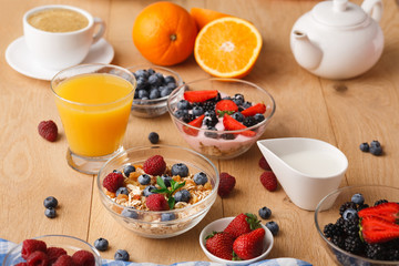 Rich breakfast on natural wooden table