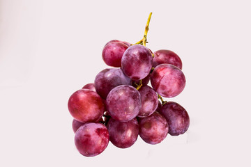 Red grapes cooked on white back ground.