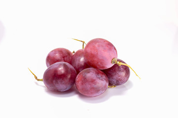Red grapes cooked on white back ground.