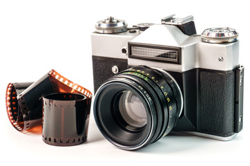 Retro film photo camera isolated on white background. Old analog