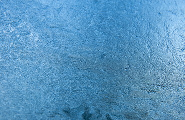 Fototapeta na wymiar Abstract blue frozen background of ice. Winter texture
