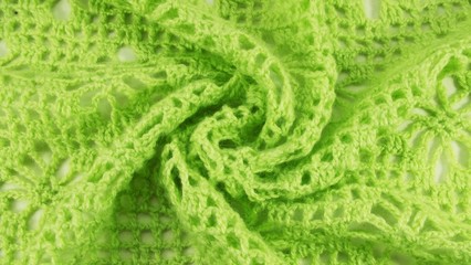 Knitted background.Knit clothes with their hands.