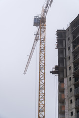 Fototapeta premium Construction of houses in winter. Severe weather