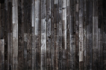 The wall or background using wood to connect to each other is a dark brown tone.