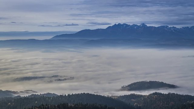 Sunrise in the Tatra mountains with flowing clouds, Poland, Timelapse