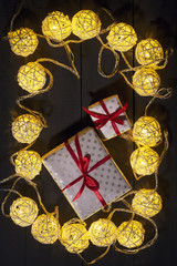 Glowing New Year garlands and ornaments on a dark background. Copy space.Holidays.Christmas, New Year.