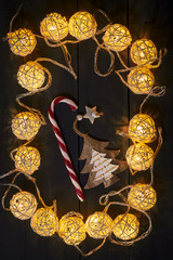 Glowing New Year garlands and ornaments on a dark background. Copy space.Holidays.Christmas, New Year.