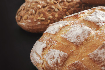Bakery concept. Plenty of bread background isolated on balck