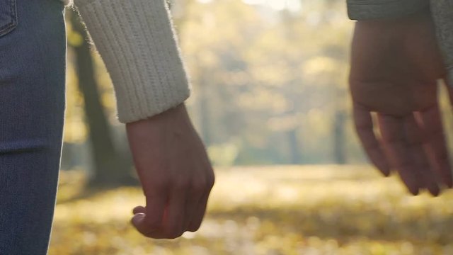 Couple letting go of their hands in slow motion, end of relationship, separation