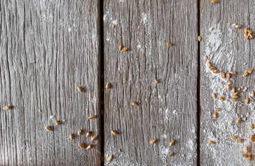 Rustic wood table sprinkled with flour closeup