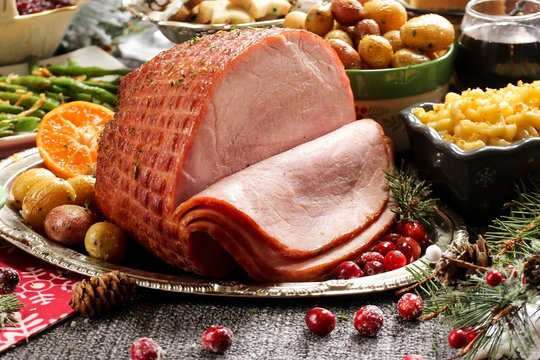  Holiday baked Ham with sides  / Xmas Dinner  table setting, selective focus