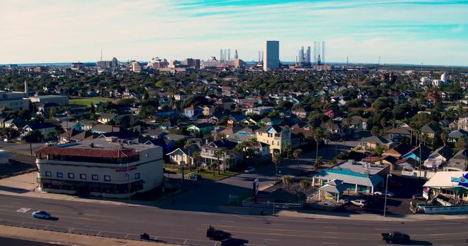 An aerial video of a sunny afternoon along the beach of Galveston, Texas