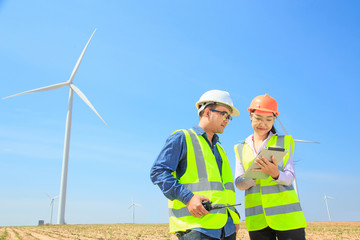 Male engineer and female engineer Working at turbine.