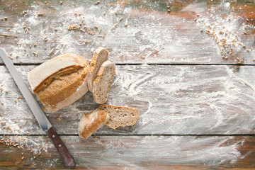 Bakery concept background. White sliced bread and knife