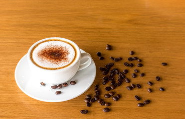 Espresso coffee on table has a coffee around.