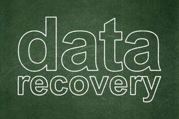Data concept: text Data Recovery on Green chalkboard background