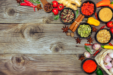 Fototapeta na wymiar Spices and herbs on wooden background