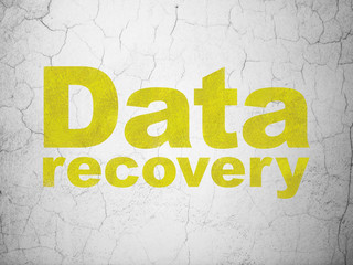Information concept: Yellow Data Recovery on textured concrete wall background