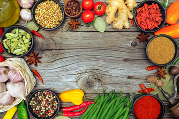 Spices and herbs on wooden background