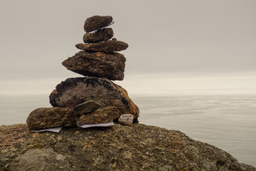 Rock stacked in tower construction on the cliff