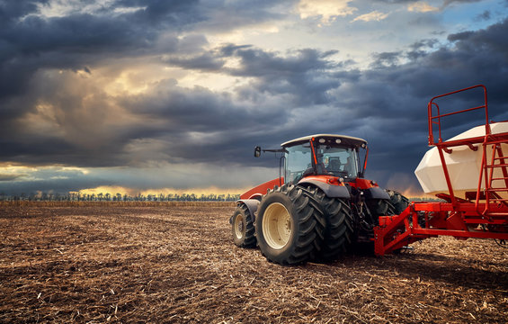 A powerful tractor works in the field