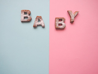 The word Baby cookies on a pink and blue  background.

