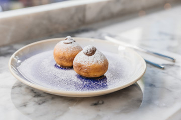 Bombolone is an Italian filled doughnut and is eaten as a snack food and dessert.