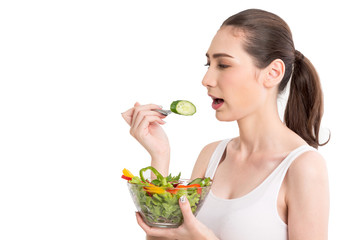 Woman holding fresh vegetable salad in glass bowl isolated on white background