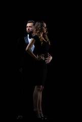 Hot girl in a black dress next to a businessman