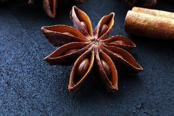 cinnamon stick and star anise spice on black background