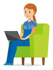 A woman nurse wearing a blue scrub is sitting on a sofa and operating a laptop computer