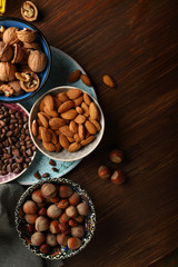 Assorted nuts on wood background