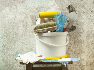 Plastic bucket with construction tools. Renovation concept.