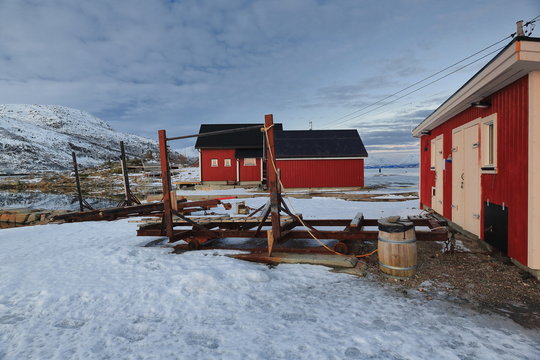 Red fishing huts on extreme N.of Hjertholmen islet-harbor E.boundary-Lodingen-Lofoten-Norway. 0663