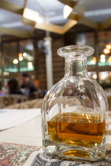 Decanter with an alcoholic drink in a restaurant