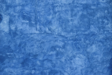 Grunge blue painted plaster wall background