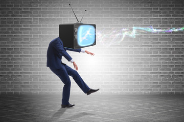 Media zombie concept with man and tv set instead of head
