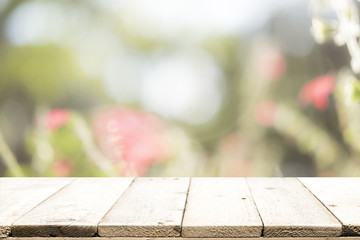 Selective focus empty wooden table on blured sweet pastel vintage bokeh background.