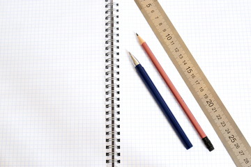 ruler, notepad, ballpoint pen and pencil 