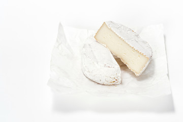 Cheese camembert on white paper. Menu design restaurant. Horizontal view. Cheese isolated.