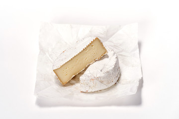 Cheese camembert on white paper. Menu design restaurant. Horizontal view. Cheese isolated.