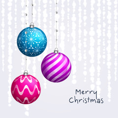 Christmas card. Xmas balls hanging on ribbons with pearls. Background with bokeh lights. Vector.
